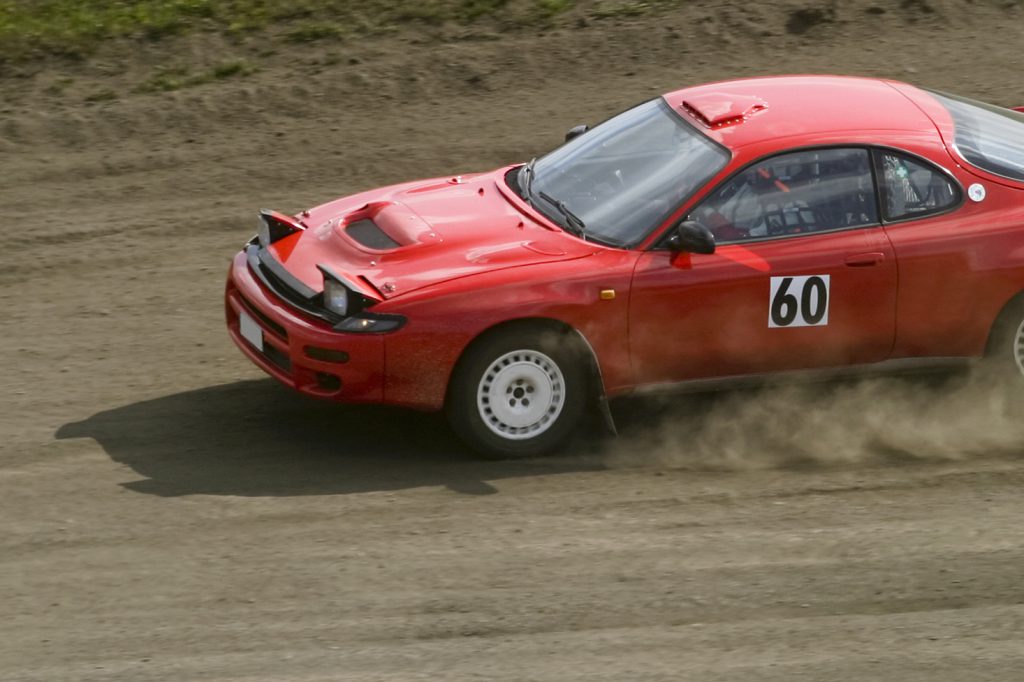 Red rally car in a race